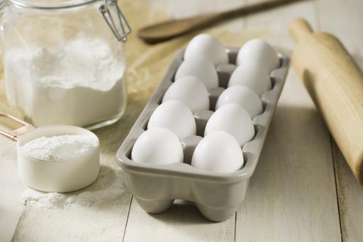 Eggs in a carton with baking supplies